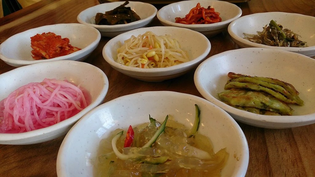 A Korean home meal spread with many colorful banchan side dishes — banchan korean side