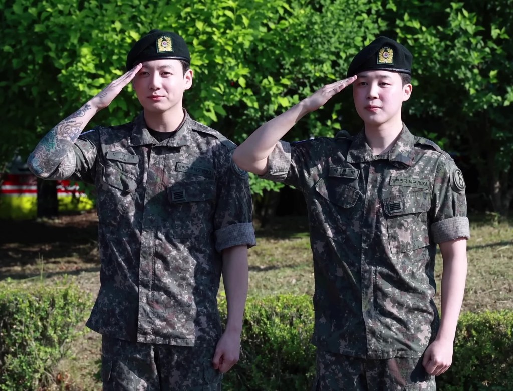 BTS Jimin and Jungkook in uniform at their military discharge in 2025, before the group's 2026 reunion — bts boknal summer