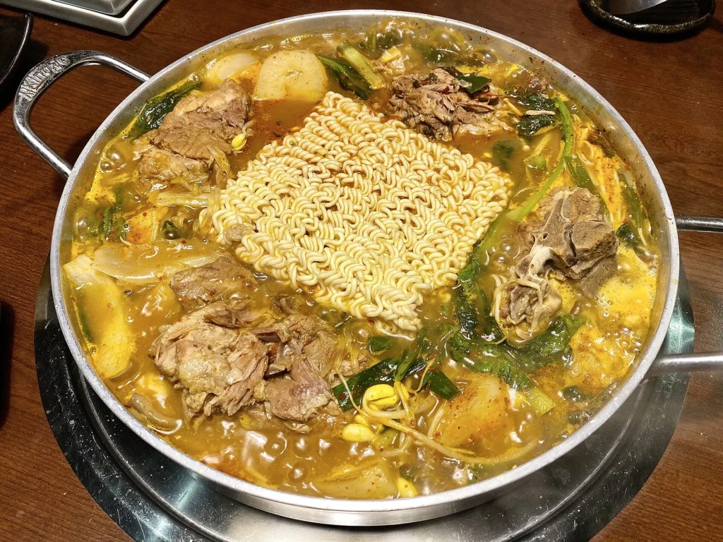 Gamjatang served with instant ramyeon noodles added to the pot, a common way Koreans eat the stew — blackpink lisa documentary
