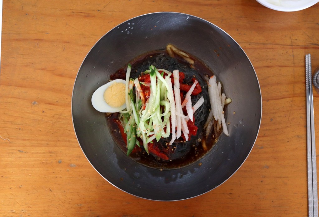 Pyongyang naengmyeon, buckwheat cold noodles in a clear mild broth — naengmyeon winter origin