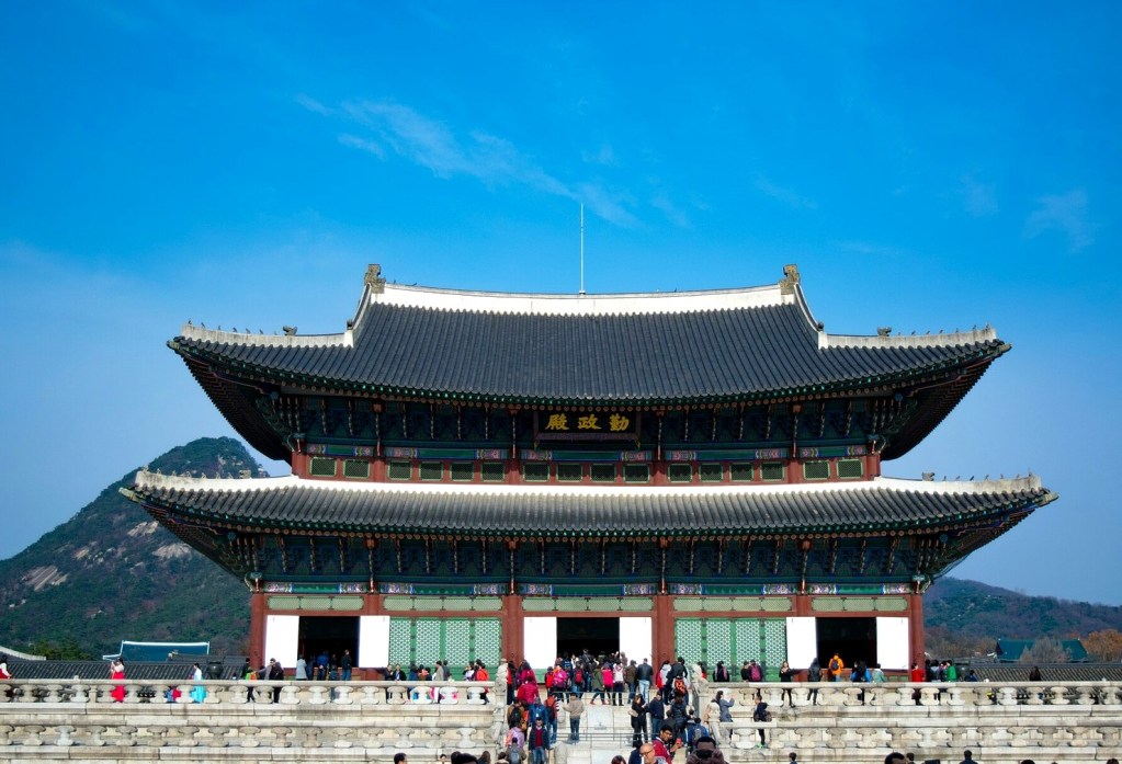 A traditional Korean royal palace hall, evoking the Joseon court — ganjang gejang king