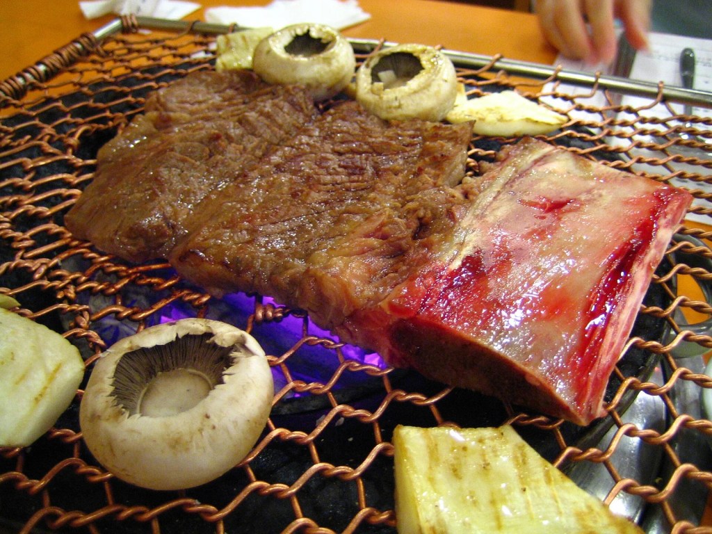 Korean galbi grilled ribs on a barbecue, a favorite of BTS Suga — bts boknal summer
