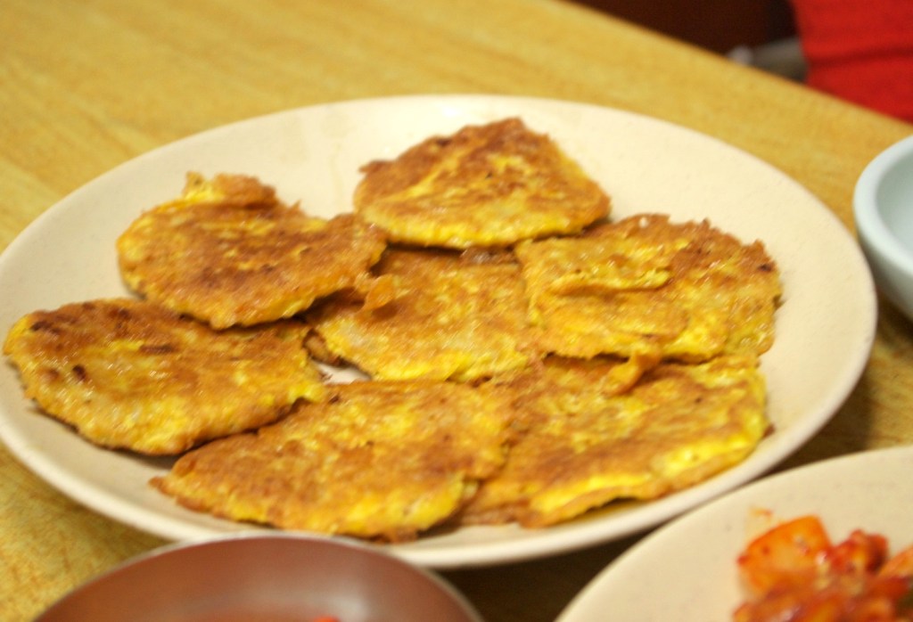 Golden Korean savory pancakes (jeon), a classic celebration dish — kdrama villain king