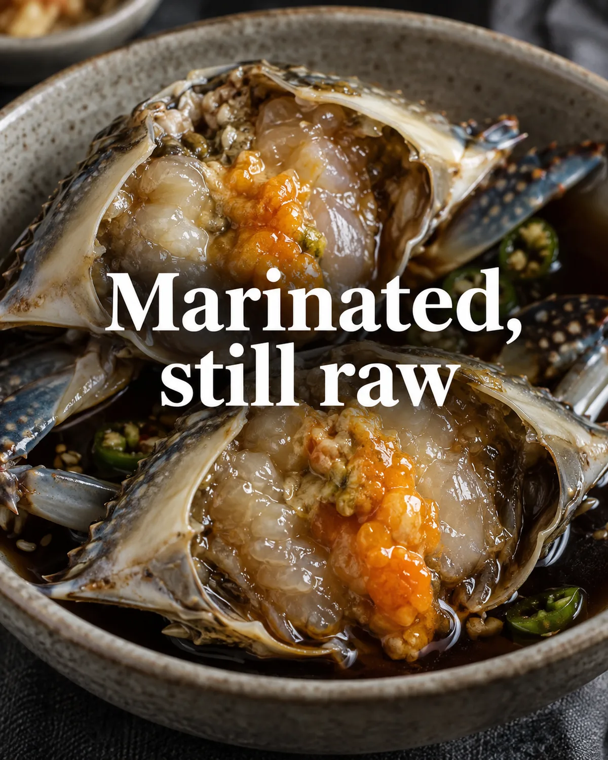Soy marination seasons the crab; it does not cook the flesh.