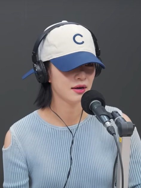 Lee Chaeyoung of fromis_9 wearing headphones during a radio broadcast — kpop smoking rumors