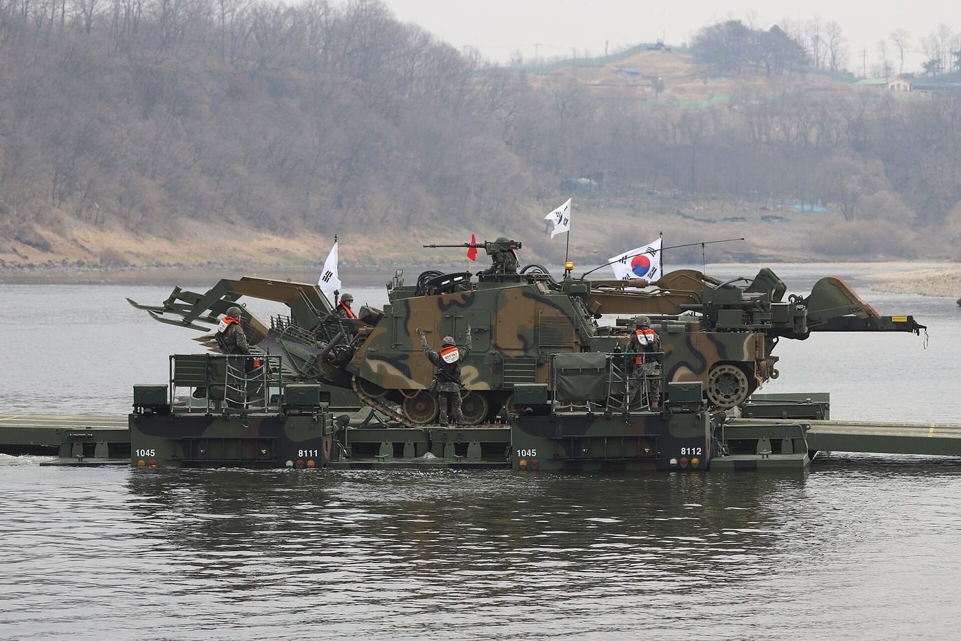 South Korean Army soldiers operating an amphibious bridging vehicle during a river-crossing training exercise — song kang military