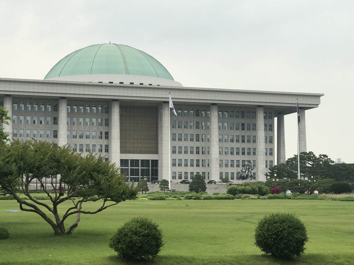 The National Assembly Building of South Korea in Seoul, with its green dome and colonnade — song kang military